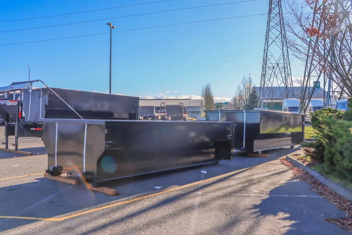 Roll-off dumpster ready for waste disposal at job site for 2 Yard Dumpster Rental in Fairview